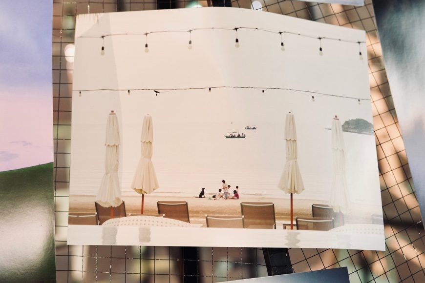 The MMAD installation wall covered in photographs