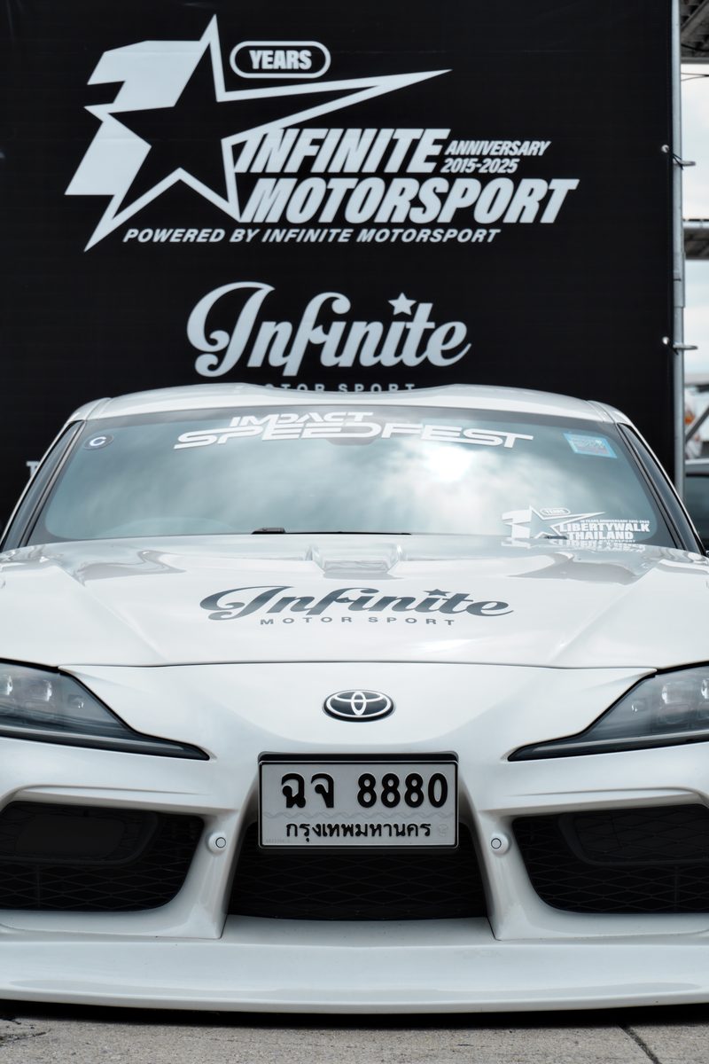 White Infinite Motorsport Supra, head on