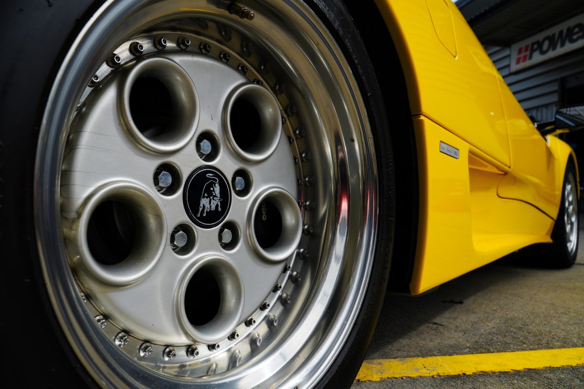 Deep-dish wheel and yellow fender, close